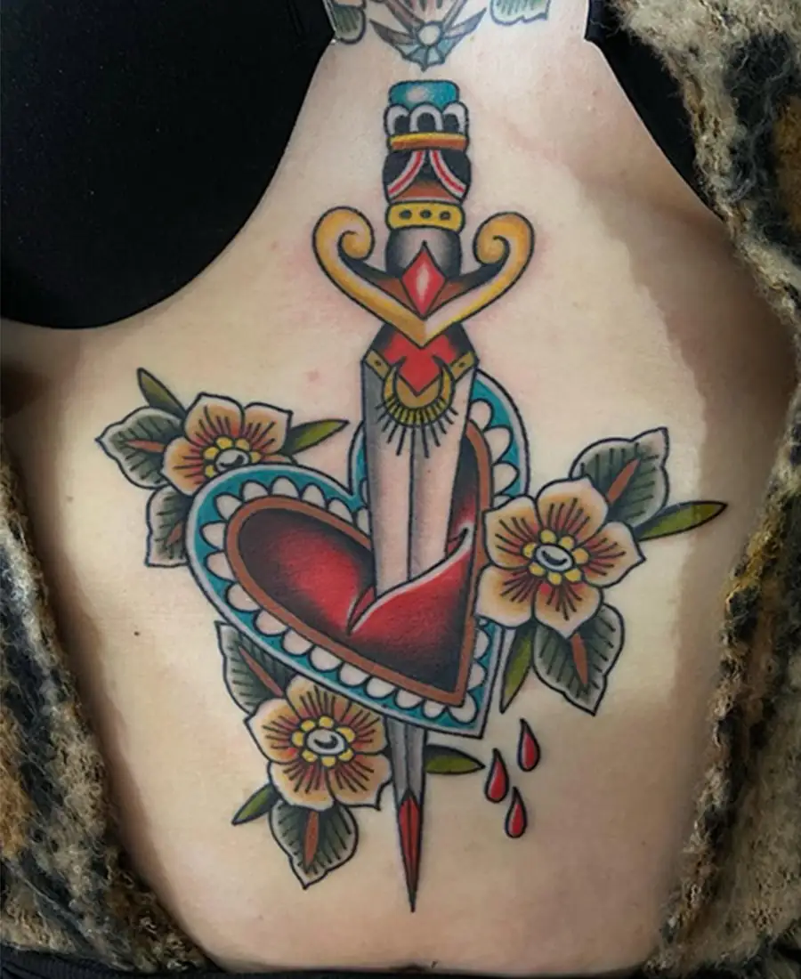 Heart and dagger sternum tattoo by Darlin Cait Nashville