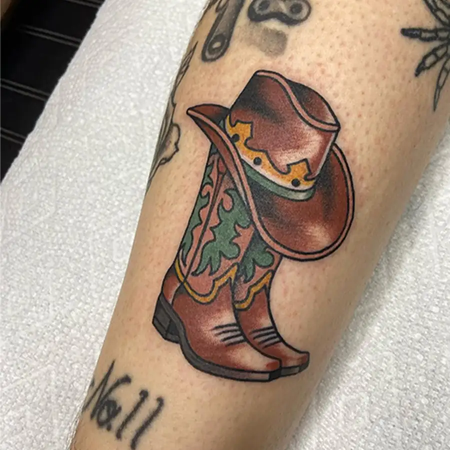 Cowboy boots traditional color tattoo by Darlin Cait Nashville