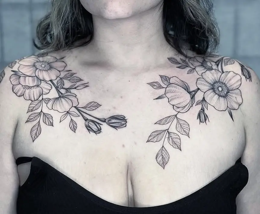Fine line floral chest tattoo by Eric Axle Nashville