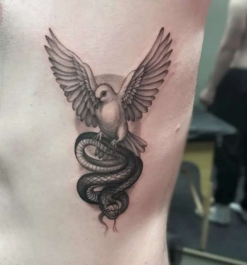 Fine line dove and snake tattoo by Eric Axle Nashville
