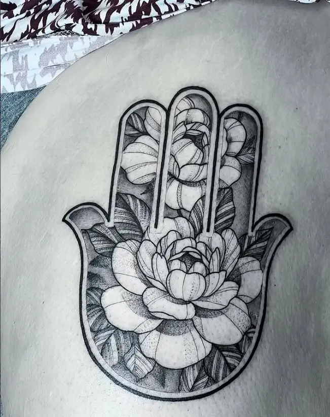 Illustrative hamsa and florals tattoo by Eric Axle Nashville