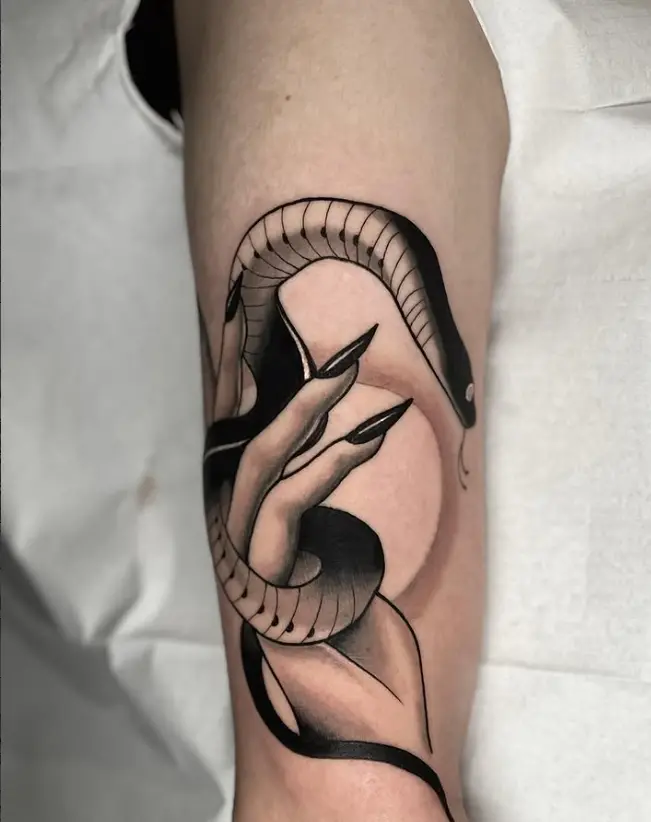 Illustrative snake and hand tattoo by Eric Axle Nashville