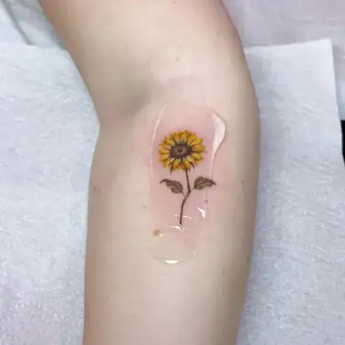 Color sunflower fine line tattoo by Natasha Rachel