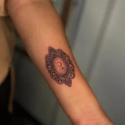 Ornate keyhole fine line tattoo by Natasha Rachel