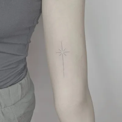 Star burst fine line tattoo by Natasha Rachel