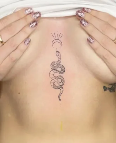 Celestial snake sternum tattoo by Natasha Rachel
