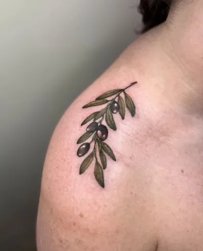 Olive branch color tattoo by Natasha Rachel