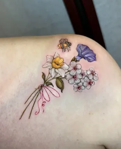 Floral bouquet with bee color tattoo by Natasha Rachel