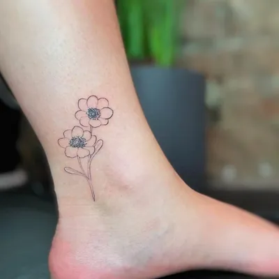 Ankle flower fine line tattoo by Natasha Rachel