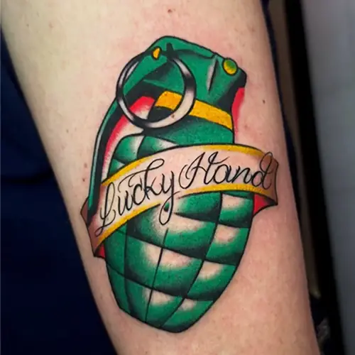 Lucky Hand grenade color tattoo by Sasha Vandal