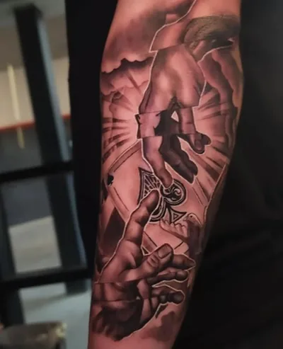 Black and grey angel hands sleeve tattoo by Skin Design