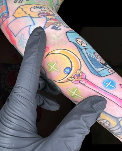 Colorful skeleton blowing bubbles tattoo by Someones Weird Sister Nashville